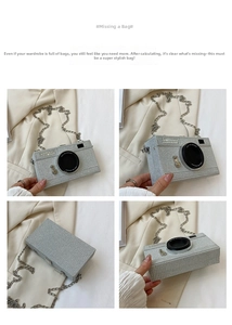 Detail view of silver camera-shaped chain bag with Steal The Spotlight lettering