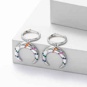 Detailed macro view of S925 silver crescent moon earrings with colorful zircon stones