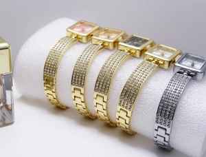 Detailed view of square quartz watches with glittering rhinestone bracelets in multi-colors