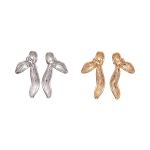 Textured metallic flower petal earrings in gold and silver finish on white background