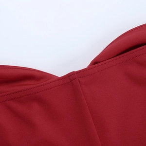 Detail of burgundy satin dress neckline showing high-quality stitching and fabric texture