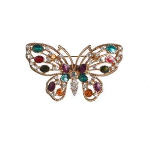 Vintage gold butterfly brooch with colorful gemstones and white cubic zirconia