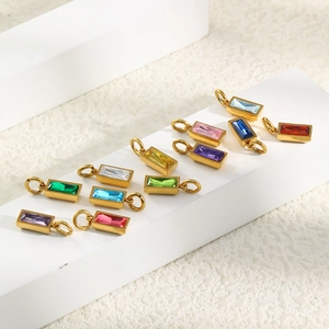 Detailed macro view of 18K gold plated stainless steel birthstone pendants in various colors
