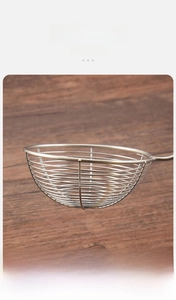 Close-up of thick stainless steel wire mesh detail on a professional food skimmer