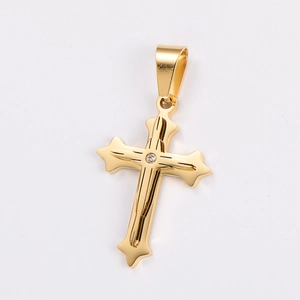 Detailed close-up of a gold-plated cross pendant featuring a centered sparkling gemstone
