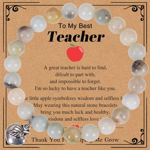Detail of natural stone teacher gift bracelet with apple charm and greeting card