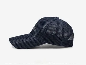 Detail of navy blue mesh baseball cap featuring NYC embroidery and breathable texture