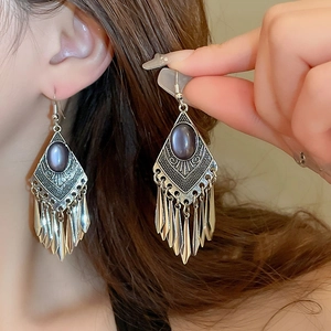Bohemian vintage tassel drop earrings with dark purple gemstone in antique silver finish