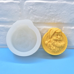Santa Claus embossed silicone mold for DIY soap, candles, and baking with yellow finished product