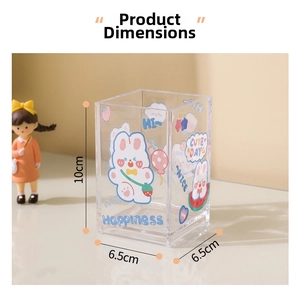 Close-up of clear acrylic stationery holder with cute cartoon rabbit and strawberry prints