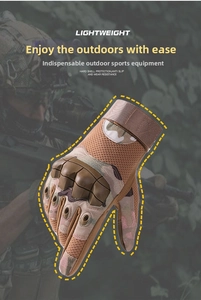 Detail of khaki camouflage tactical gloves with hard shell protection and wrist strap