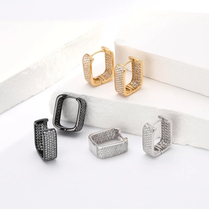 Detailed macro view of rectangular s925 silver hoop earrings with micro-pave cubic zirconia