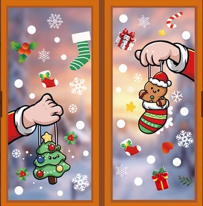 Stickers de fenêtre de Noël avec bonhommes de pain d'épices, sapins et flocons sur verre