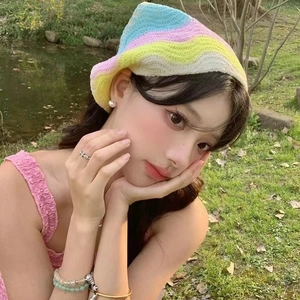 Close-up of a colorful rainbow crochet headscarf with floral knit patterns for women