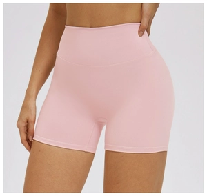Macro shot of high-waist yoga shorts featuring pink ribbed texture and tummy control