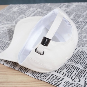 White solid color baseball cap with adjustable metal buckle and interior lining details