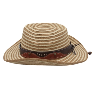 Close-up of woven straw cowboy hat with brown leather band and decorative metal studs