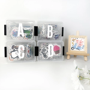 Clear storage boxes for 3-inch alphabet stickers shown with decorative daisy props