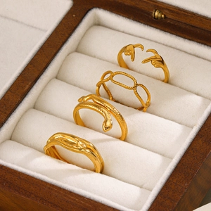 Set of four 18K gold-plated stainless steel rings with snake and chain designs
