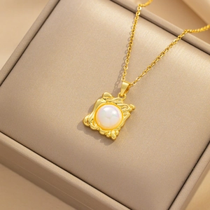 French luxury irregular square gold necklace with pearl pendant on jewelry box