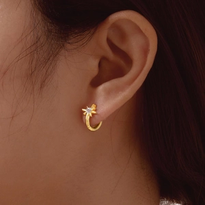 Golden stainless steel hoop earrings with crystal star pendant for women in high-gloss finish