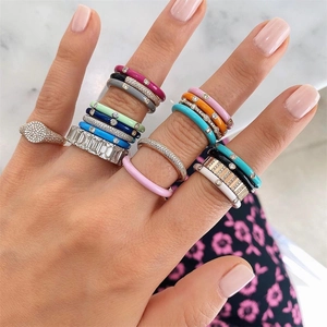 Colorful enamel ring set with 18K gold plating and sparkling zircon stones on model hands