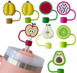 Detail of colorful fruit-shaped PVC straw covers including apple and avocado models