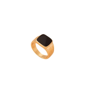 Minimalist gold ring with a square black inlay gemstone set on a white background