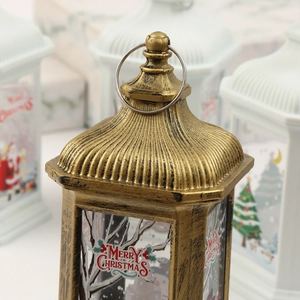 Close-up of vintage gold Christmas LED lantern with Merry Christmas print and top ring