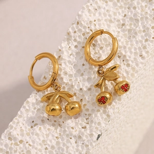 18K gold plated stainless steel cherry earrings with red rhinestones on white stone