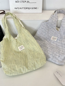 Minimalist blue plaid canvas tote bag with retro aesthetic and sozakka logo label