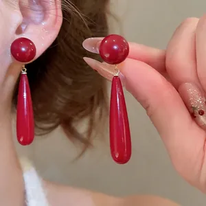 Elegant 18k gold plated silver needle pearl earrings with bright red water drop pendants