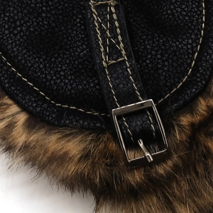 Detail of black faux leather aviator hat with brown fur lining and yellow stitching