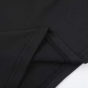 Detailed close-up showing high-quality stitching and black lace fabric texture of the dress