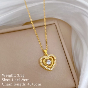 Macro shot of gold double heart pendant necklace with dimensions 1.4x1.9cm and 3.3g weight