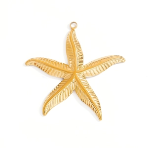 Polished gold starfish pendant with connector ring for marine jewelry making