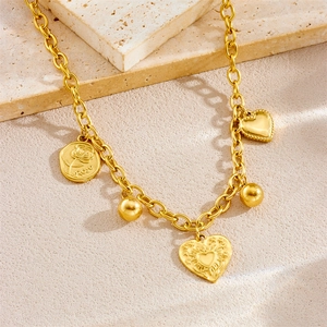Gold plated stainless steel necklace with sun, heart, and rose pendants on stone