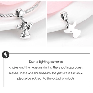 Detailed macro view of S925 sterling silver angel wing charm on snake chain