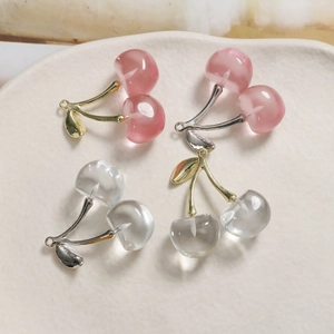 Translucent cherry pendants in pink and clear glass with gold and silver metal accents