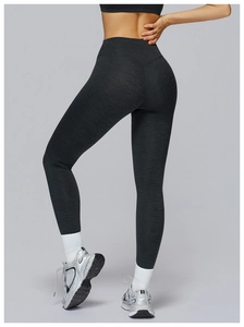 Detail view of high-waisted gray yoga pants featuring ergonomic stitching and body shaping