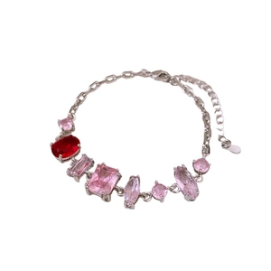 French vintage silver bracelet with red and pink geometric zircon stones on white background