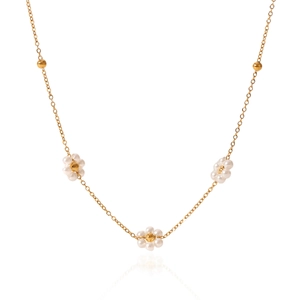 Elegant gold stainless steel necklace featuring pearl floral pendants and tiny golden beads