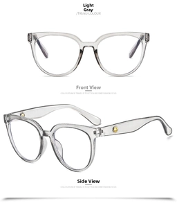 Detail of light grey oversized glasses frame with stylish gold metal temple accents