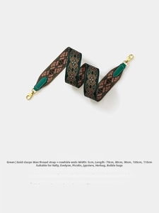 5cm wide geometric jacquard woven bag strap with green leather and gold hardware
