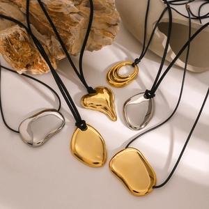 Irregular geometric pendant necklaces in gold and silver finish with black cord chains