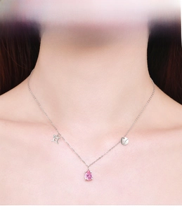 Close-up of S925 sterling silver Gemini necklace with pink pear-cut gemstone pendant