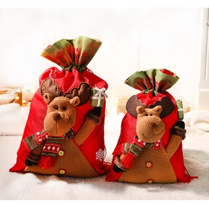 Detail view of plush Christmas reindeer gift bags with festive 3D fabric decorations