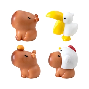 Cute Capybara and Pelican figurines with orange and chicken hat for desktop decor