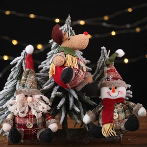 Three-piece Christmas ornaments set featuring plush Santa, elk, and snowman in plaid fabric
