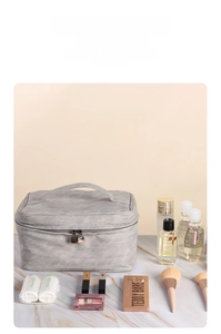 Large gray PU leather makeup bag with handle and dual zippers for travel storage